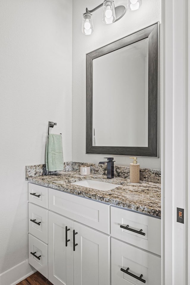 bathroom with wood-type flooring and vanity