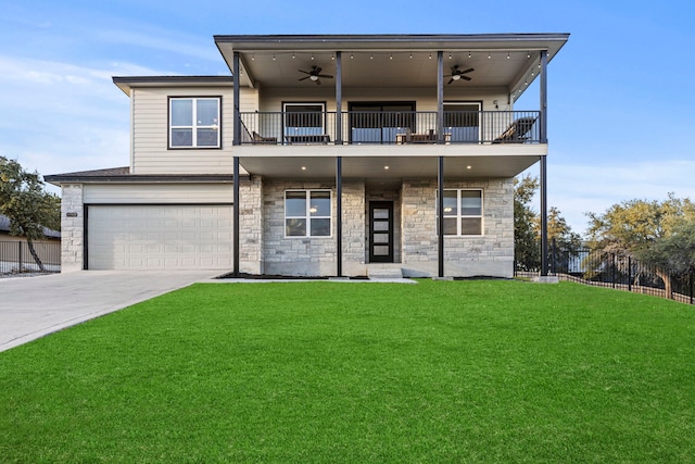 view of front of property with a front lawn, a garage, a balcony, and ceiling fan