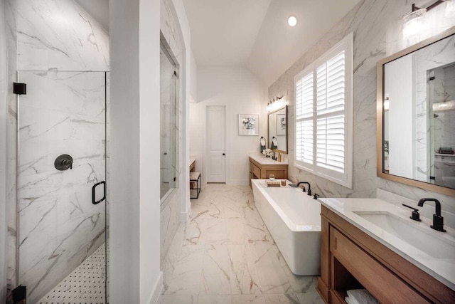 bathroom with vanity, vaulted ceiling, and shower with separate bathtub