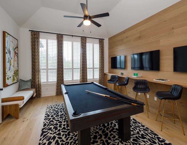 rec room featuring plenty of natural light, pool table, wood walls, and light hardwood / wood-style flooring