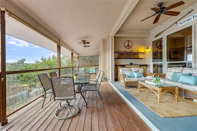 sunroom / solarium with ceiling fan