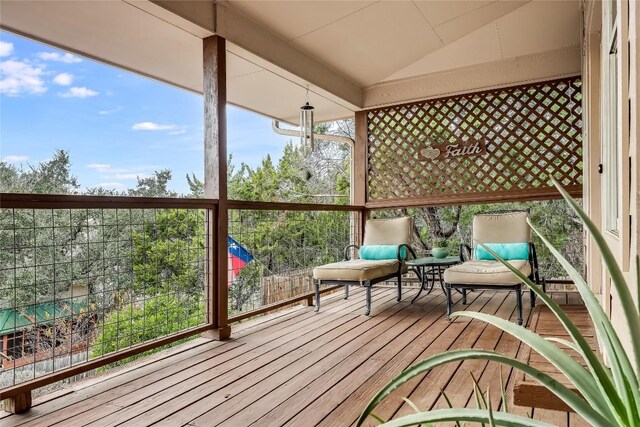 unfurnished sunroom with lofted ceiling