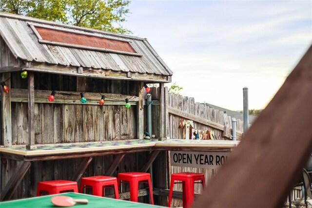 view of jungle gym featuring exterior bar