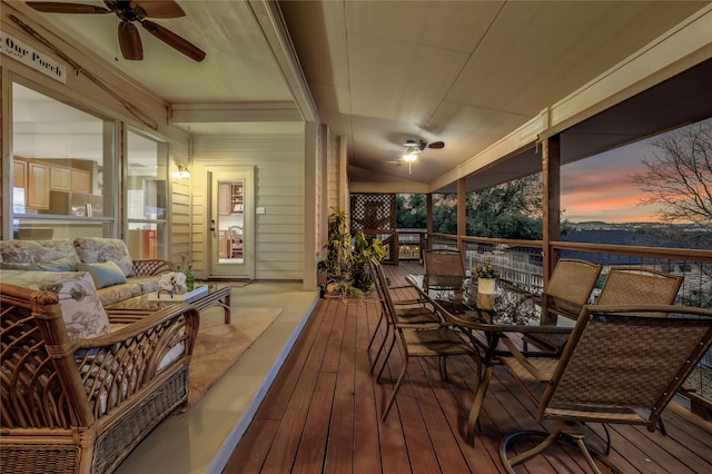 sunroom featuring ceiling fan and a wealth of natural light