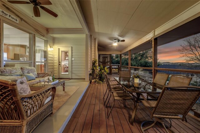 sunroom featuring ceiling fan