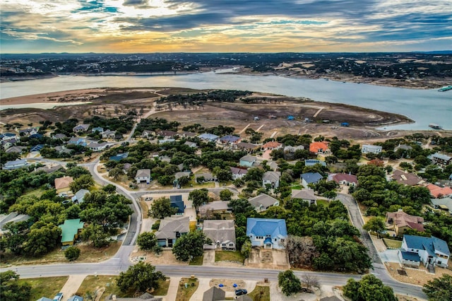 aerial view at dusk with a water view