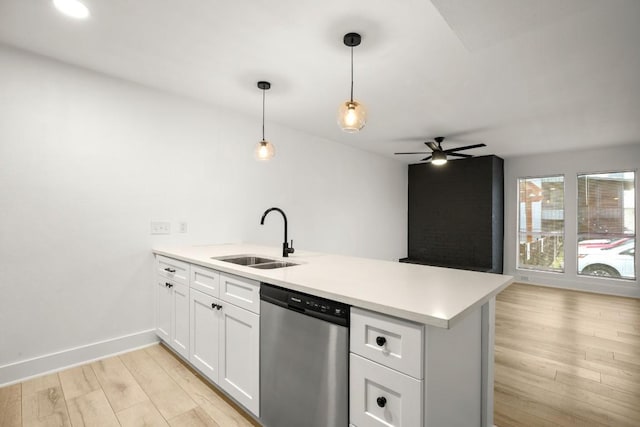 909 Reinli St Unit 103, Austin, TX 78751 - kitchen featuring dishwasher, a peninsula, a ceiling fan, light wood finished floors, and light countertops