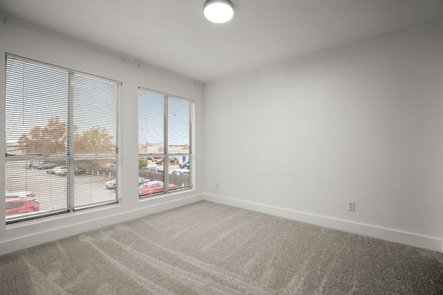909 Reinli St Unit 103, Austin, TX 78751 - spare room with light carpet and baseboards