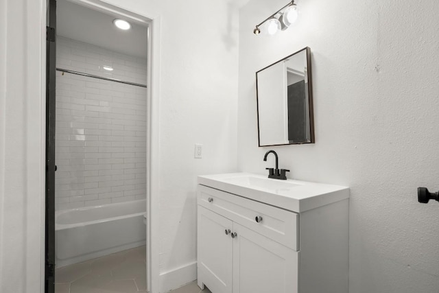 909 Reinli St Unit 103, Austin, TX 78751 - full bath featuring vanity, shower / washtub combination, recessed lighting, and tile patterned floors
