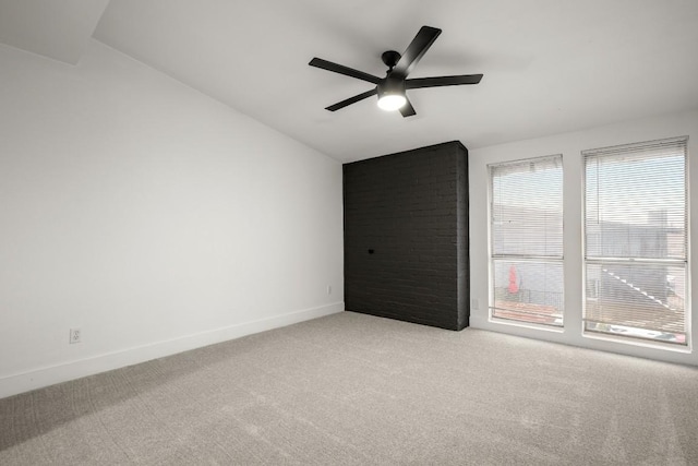909 Reinli St Unit 103, Austin, TX 78751 - empty room with light colored carpet, vaulted ceiling, and ceiling fan
