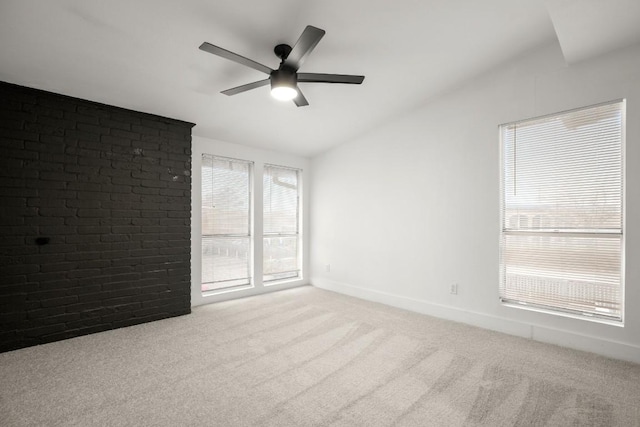 909 Reinli St Unit 103, Austin, TX 78751 - unfurnished room with vaulted ceiling, carpet, and a ceiling fan