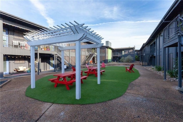 view of playground with a pergola