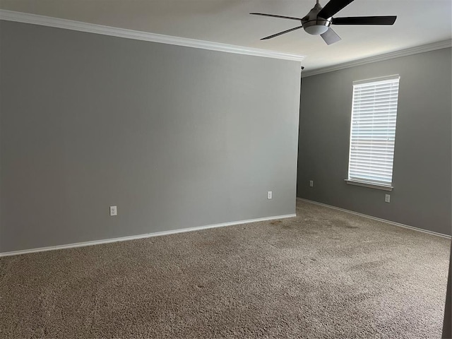 empty room with ceiling fan, crown molding, and carpet flooring