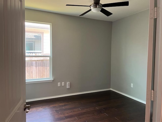 unfurnished room featuring ceiling fan and dark hardwood / wood-style flooring