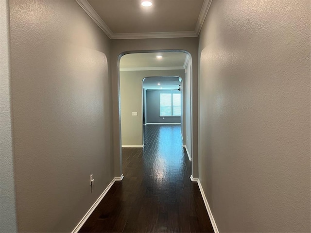 hall featuring dark hardwood / wood-style floors and crown molding