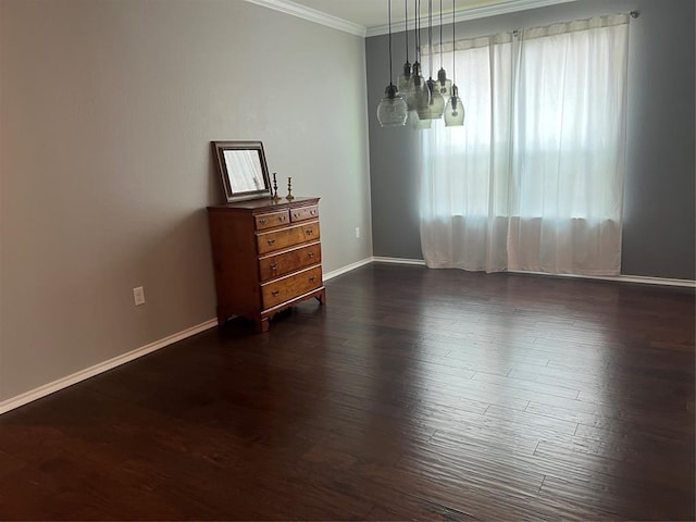 unfurnished room featuring ornamental molding and dark hardwood / wood-style floors