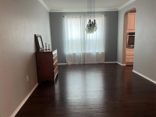 unfurnished dining area featuring dark hardwood / wood-style flooring and crown molding