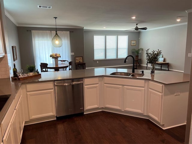 kitchen with ceiling fan, white cabinetry, stainless steel dishwasher, and sink