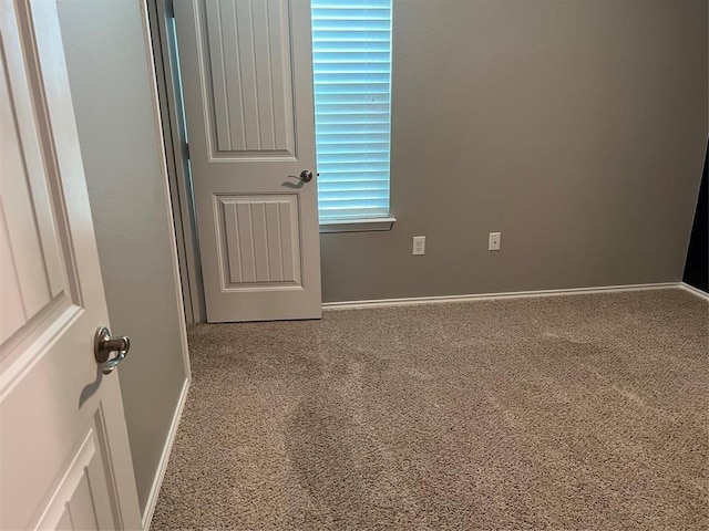 unfurnished room with carpet flooring