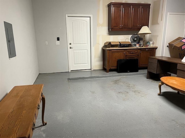 interior space with electric panel and dark brown cabinetry