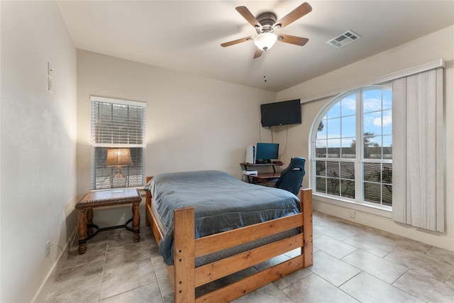 tiled bedroom with ceiling fan