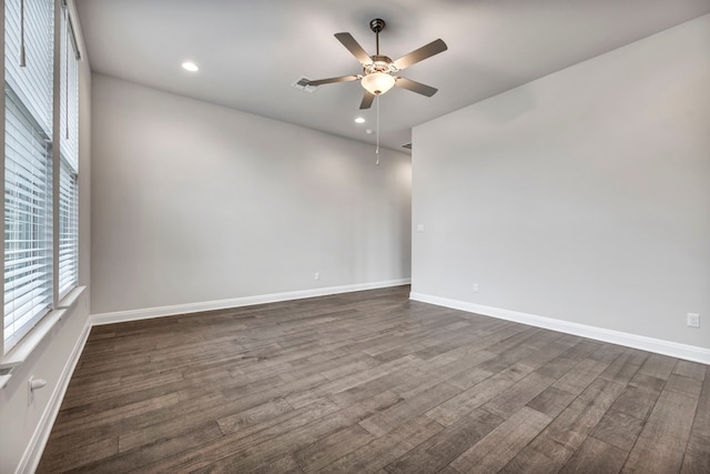 unfurnished room featuring ceiling fan and dark hardwood / wood-style flooring