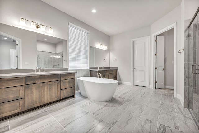 bathroom featuring separate shower and tub and vanity