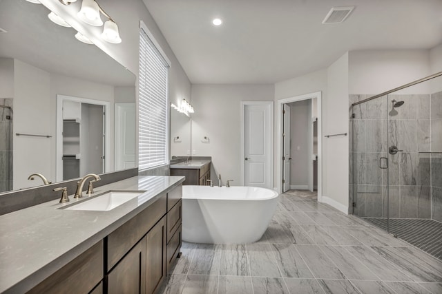 bathroom with vanity and plus walk in shower