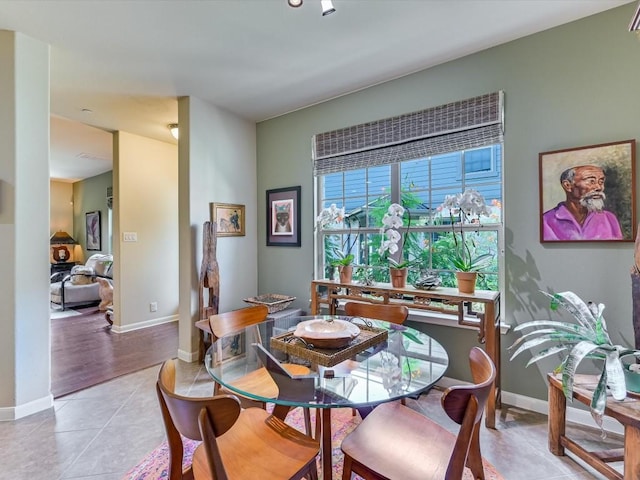 dining area with light tile patterned floors