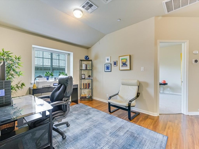 office featuring light hardwood / wood-style flooring and vaulted ceiling