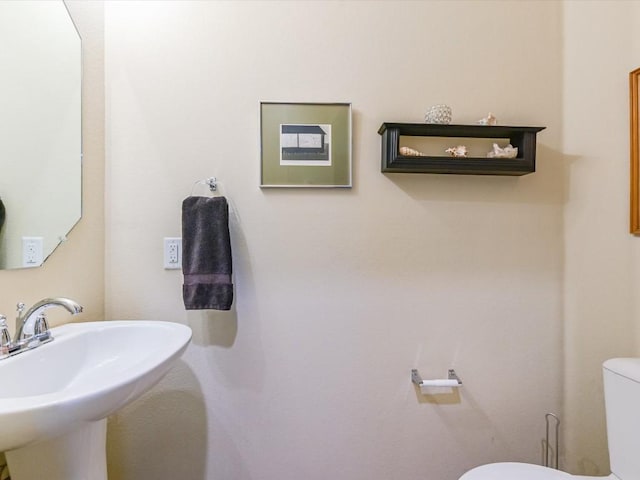 bathroom with sink and toilet