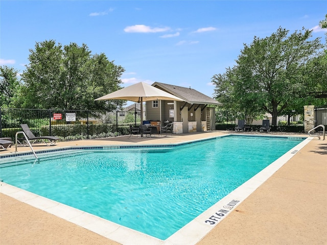 view of swimming pool featuring a patio