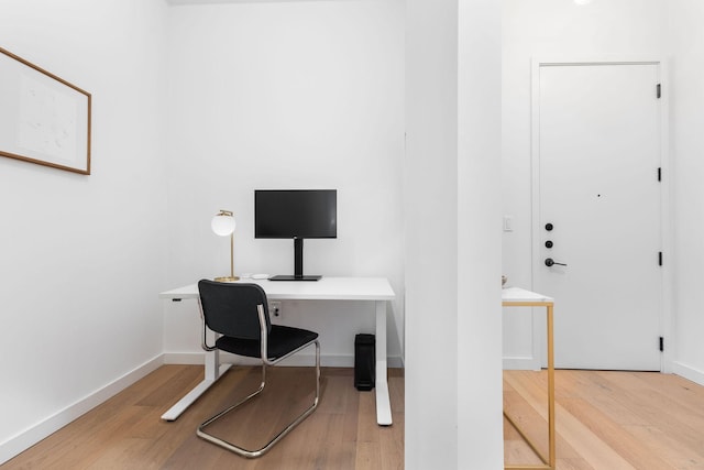 home office with hardwood / wood-style flooring