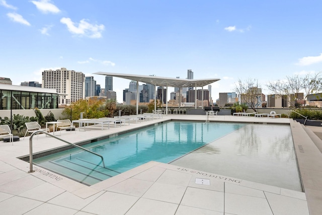 view of swimming pool with a patio area