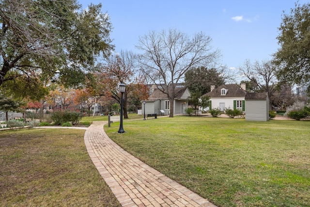 view of home's community featuring a lawn