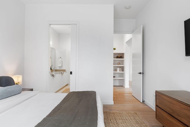 bedroom with light hardwood / wood-style floors