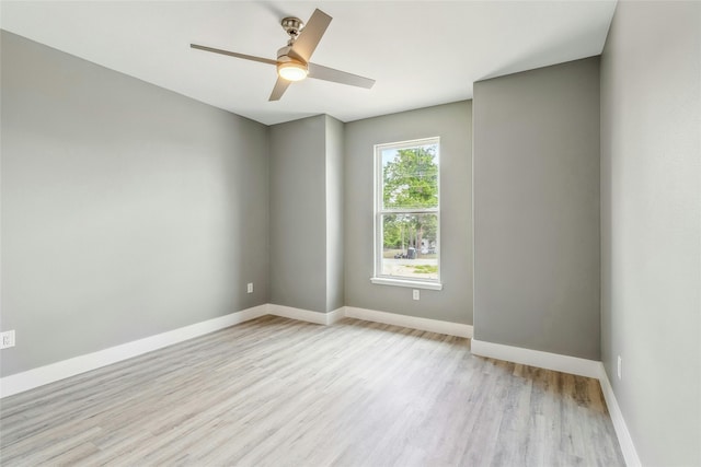 unfurnished room featuring light wood-type flooring and ceiling fan