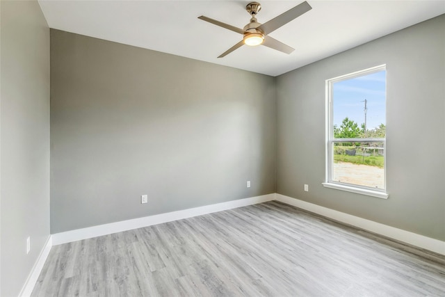 empty room featuring ceiling fan and light wood-type flooring