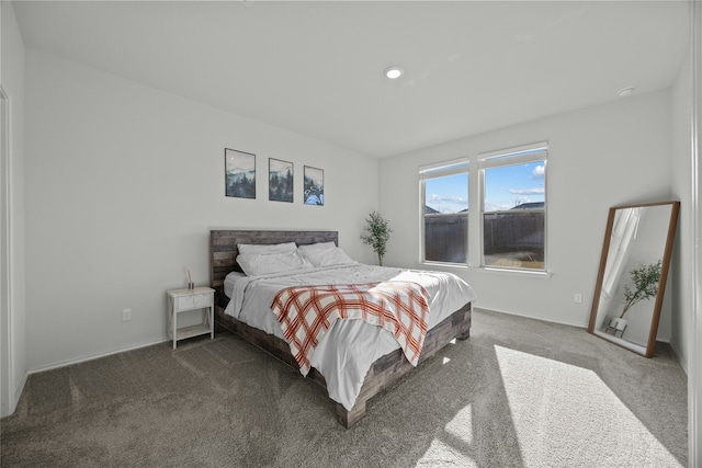 bedroom with dark carpet