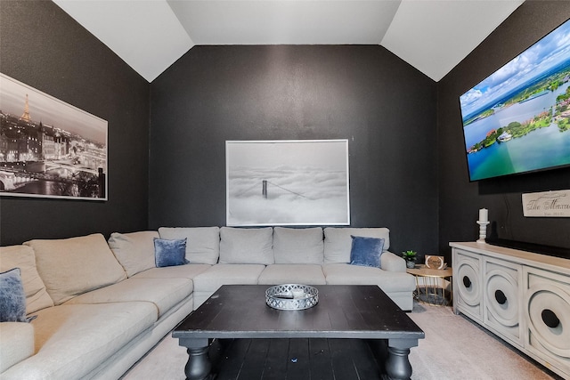 living room featuring lofted ceiling