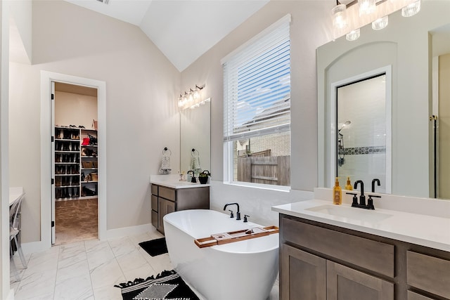 bathroom featuring vanity, vaulted ceiling, and plus walk in shower