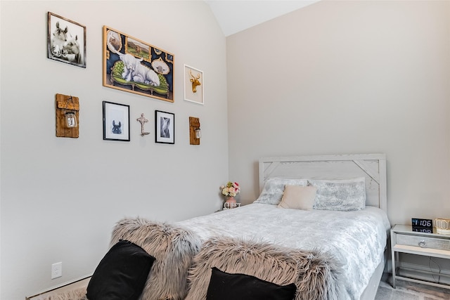 bedroom with lofted ceiling