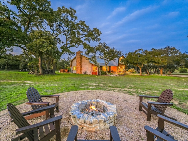 view of yard with a patio area and a fire pit