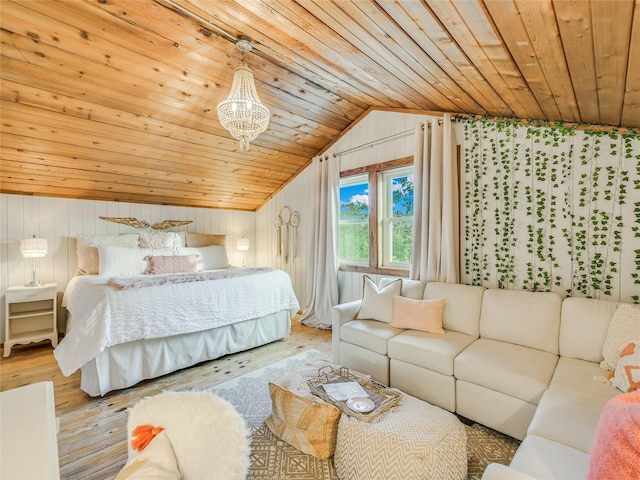 bedroom with lofted ceiling, wood walls, light hardwood / wood-style floors, and wooden ceiling