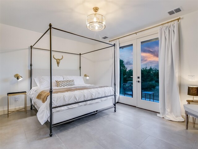 bedroom featuring multiple windows, access to outside, and french doors