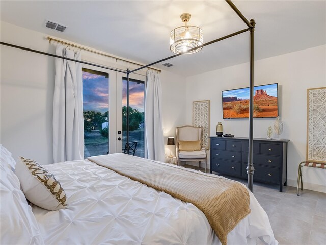 bedroom with access to exterior and french doors