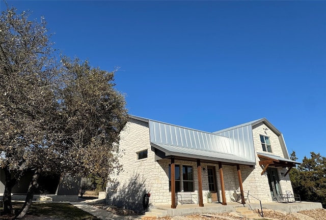 view of home's exterior featuring covered porch