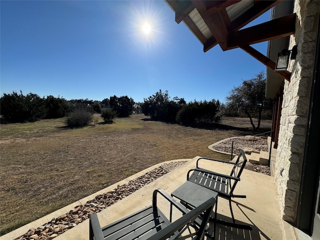 view of patio / terrace with a rural view