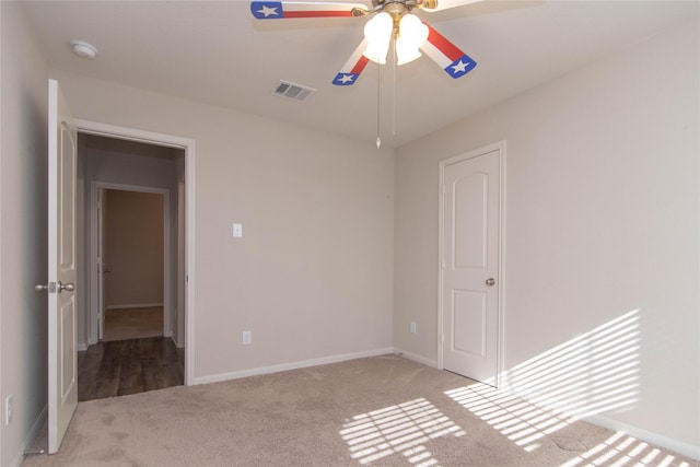 unfurnished bedroom with light carpet and ceiling fan