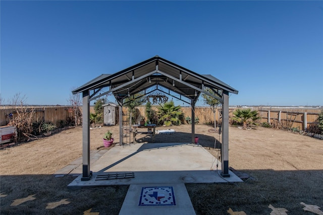 view of patio / terrace featuring a gazebo and a storage unit